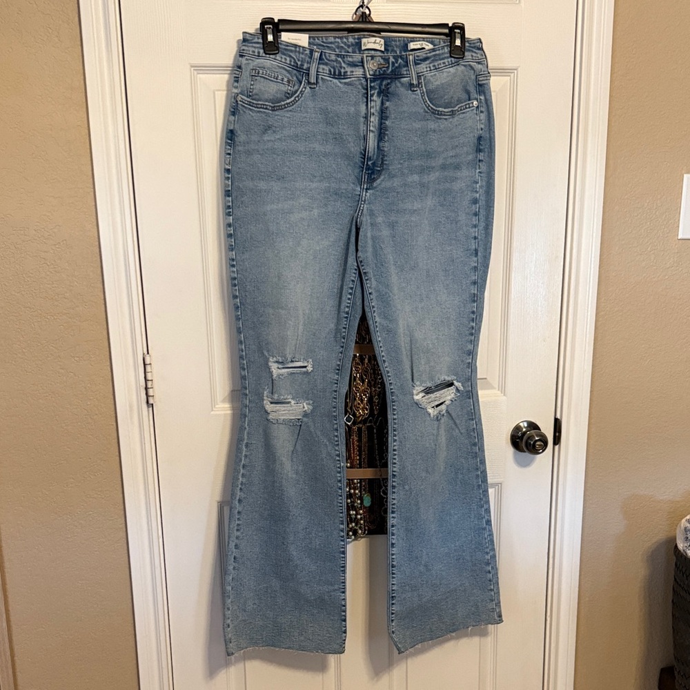 Wonderly Light Blue Flare Jeans with distressed knees. Size 14 Regular. NWT